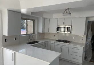 all white kitchen with white countertops
