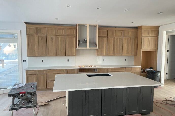 Kitchen renovation in progress, featuring a marble countertop installation