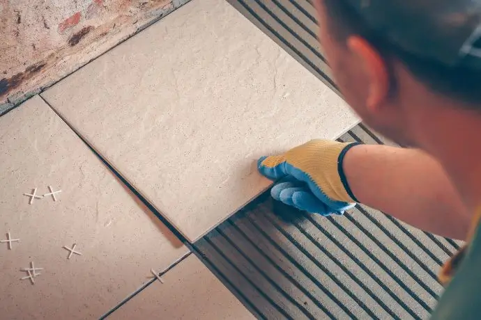 Contractor Installing Tile Flooring